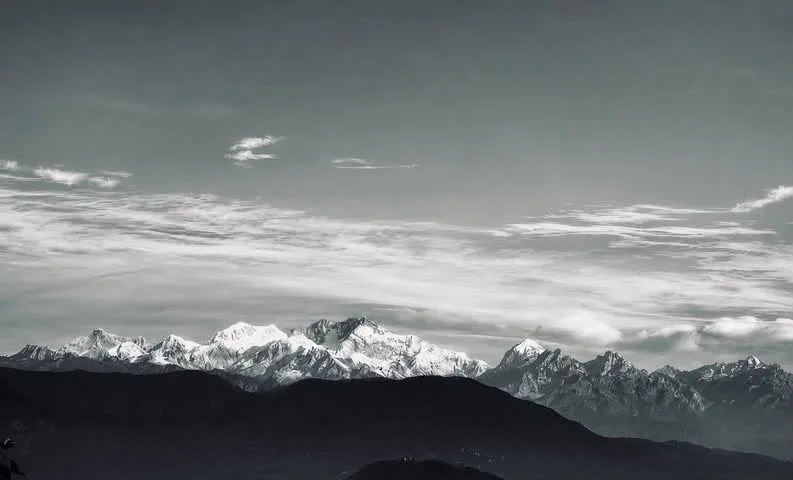 Panoramic view of snow-capped Kanchenjunga mountain range seen from Zambala Dwelling Nest homestay in Sukhia Pokhari Darjeeling